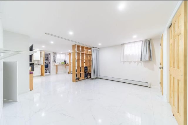 40-02 202nd St, Bayside, NY 11361 - below grade area featuring baseboard heating, light marble finish flooring, and recessed lighting