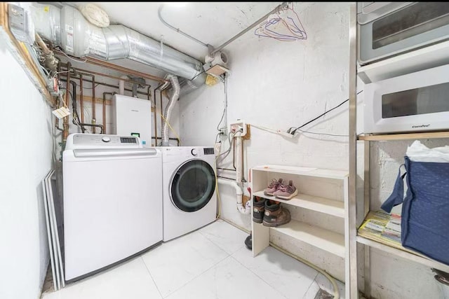 40-02 202nd St, Bayside, NY 11361 - laundry room with washing machine and dryer and water heater