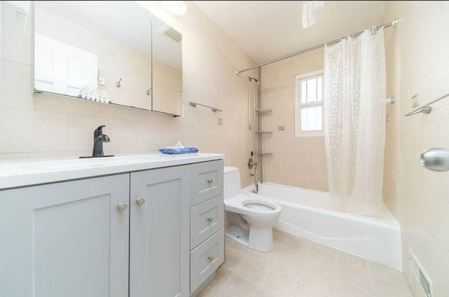 40-02 202nd St, Bayside, NY 11361 - full bath with shower / bath combo, vanity, tile walls, and tile patterned floors