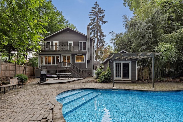 41 River Rd, Nyack, NY 10960 - back of house featuring a pergola, a balcony, a patio area, a chimney, and a deck