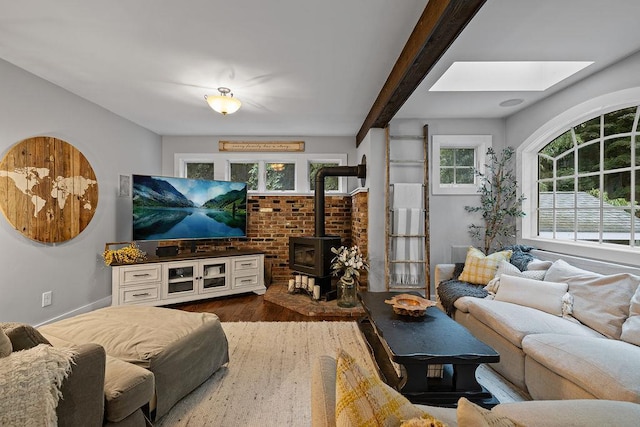 41 River Rd, Nyack, NY 10960 - living room with a skylight, a wood stove, dark wood-type flooring, and beam ceiling