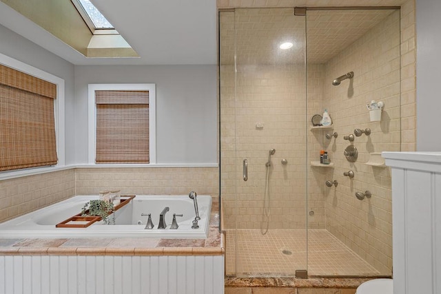 41 River Rd, Nyack, NY 10960 - bathroom featuring a stall shower, a bath, and a skylight