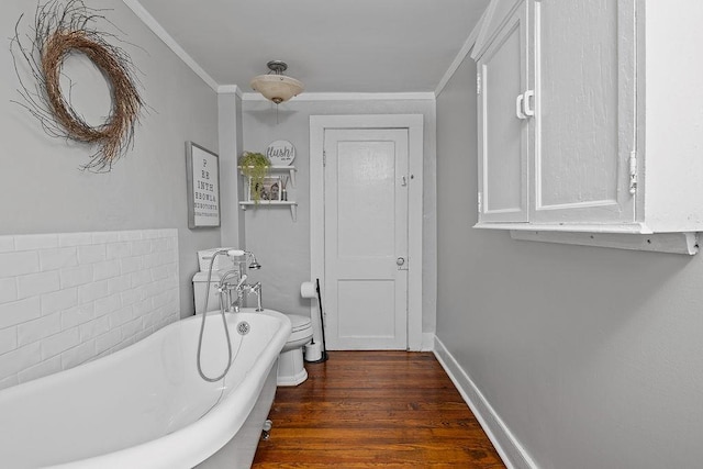 41 River Rd, Nyack, NY 10960 - bathroom with a freestanding bath, wood finished floors, and crown molding