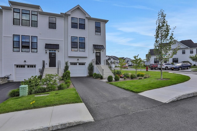 23 Champlain Way, Wappingers Falls, NY 12590 - multi unit property with driveway, a garage, a residential view, and a front yard