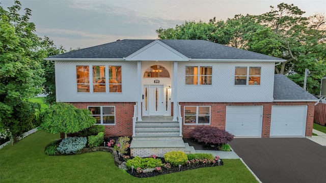 2508 Centre Ave, Bellmore, NY 11710 - split foyer home featuring driveway, brick siding, and roof with shingles