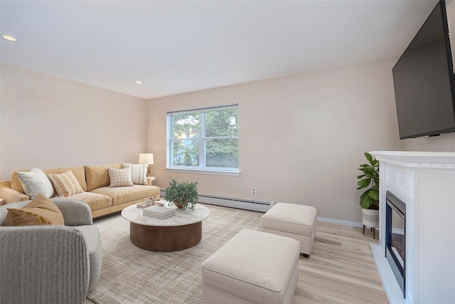 2508 Centre Ave, Bellmore, NY 11710 - living room with a baseboard radiator, a glass covered fireplace, light wood-style floors, and recessed lighting