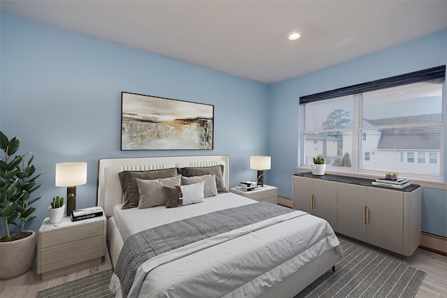 2508 Centre Ave, Bellmore, NY 11710 - bedroom with light wood-style flooring, a baseboard radiator, and recessed lighting