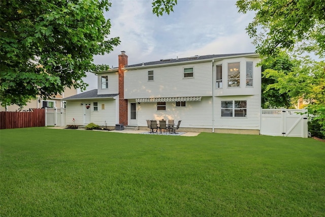 2508 Centre Ave, Bellmore, NY 11710 - back of house featuring a gate, a chimney, a fenced backyard, and a patio area