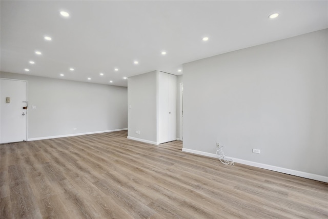 2 Bay Club Dr Unit 3P, Bayside, NY 11360 - unfurnished living room featuring recessed lighting and light wood-style floors