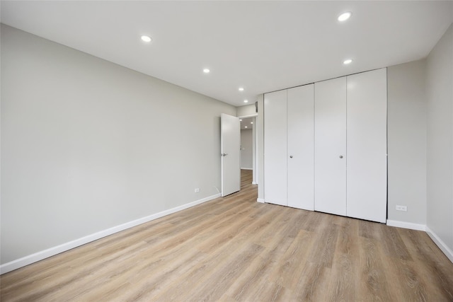 2 Bay Club Dr Unit 3P, Bayside, NY 11360 - unfurnished bedroom with light wood-type flooring, recessed lighting, and a closet