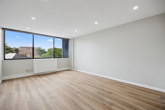 2 Bay Club Dr Unit 3P, Bayside, NY 11360 - empty room featuring wood finished floors and recessed lighting