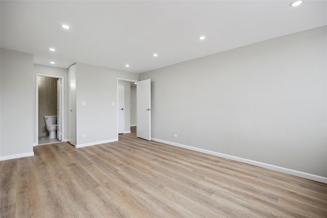 2 Bay Club Dr Unit 3P, Bayside, NY 11360 - unfurnished bedroom with recessed lighting, light wood-style floors, and connected bathroom