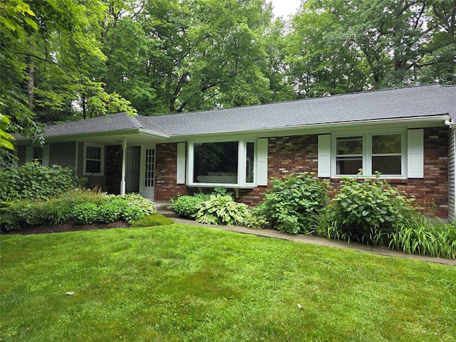 34 Hudson Dr, Hyde Park, NY 12538 - ranch-style home with brick siding, a front lawn, and a shingled roof