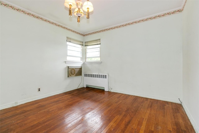 11 Webb Hill Rd, Great Neck, NY 11020 - empty room with radiator, a chandelier, and hardwood / wood-style floors