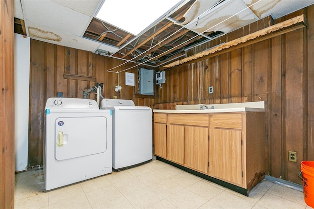 11 Webb Hill Rd, Great Neck, NY 11020 - laundry area with separate washer and dryer, cabinet space, wood walls, and electric panel
