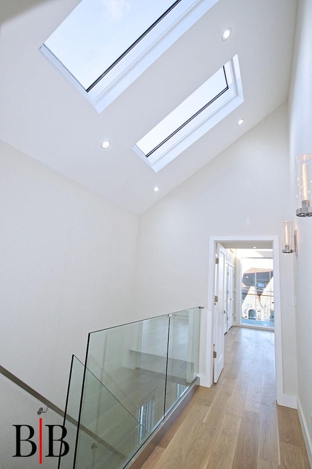 82 Piedmont Ave, Staten Island, NY 10305 - corridor with a skylight, high vaulted ceiling, light wood-style floors, and recessed lighting
