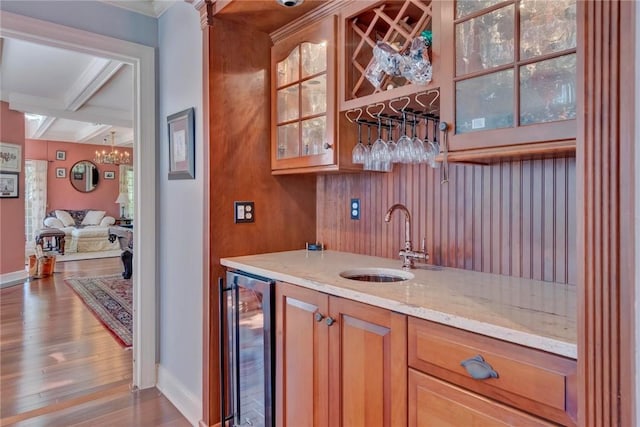 84 Highview Ave, Nanuet, NY 10954 - indoor wet bar featuring beverage cooler, wood finished floors, beam ceiling, coffered ceiling, and crown molding