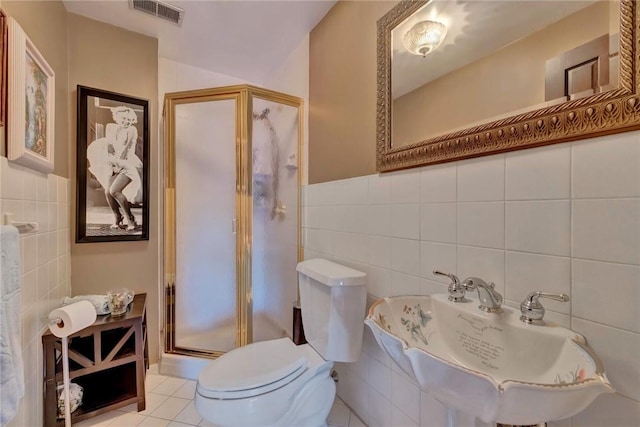 84 Highview Ave, Nanuet, NY 10954 - full bathroom featuring tile walls, a stall shower, and tile patterned floors