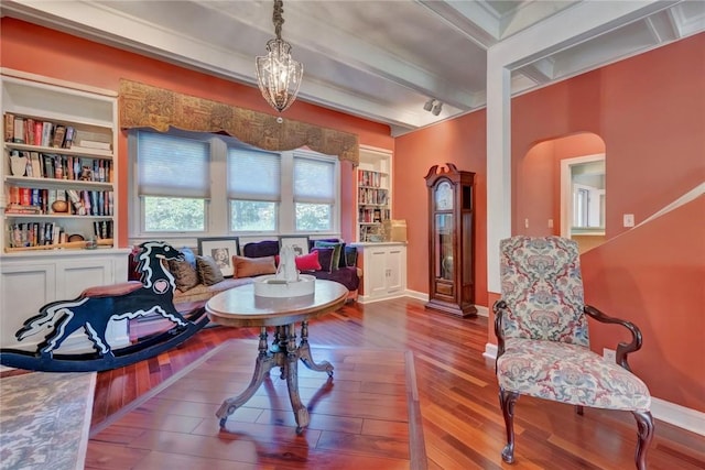 84 Highview Ave, Nanuet, NY 10954 - dining area with arched walkways, hardwood / wood-style floors, and beam ceiling