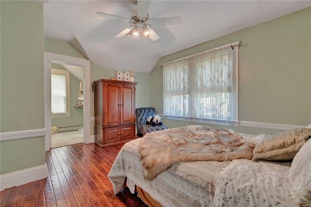 84 Highview Ave, Nanuet, NY 10954 - bedroom featuring wood finished floors, multiple windows, lofted ceiling, a baseboard heating unit, and ceiling fan
