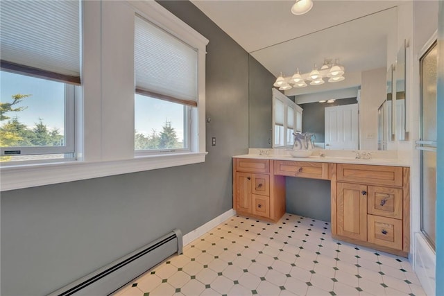 84 Highview Ave, Nanuet, NY 10954 - full bathroom featuring a baseboard heating unit, healthy amount of natural light, tile patterned floors, and double vanity