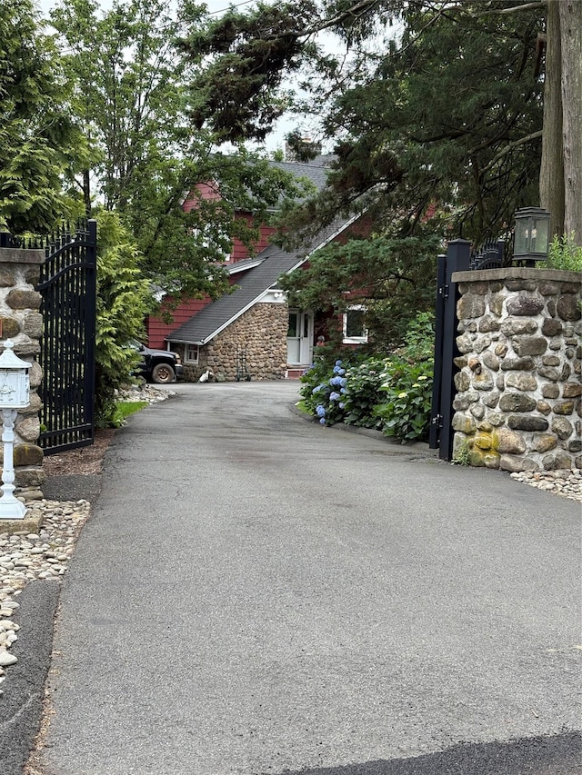 84 Highview Ave, Nanuet, NY 10954 - view of asphalt driveway with a gate and a gated entry