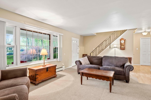 5 Seward Ln, Stony Brook, NY 11790 - living room with baseboard heating, stairs, and light carpet