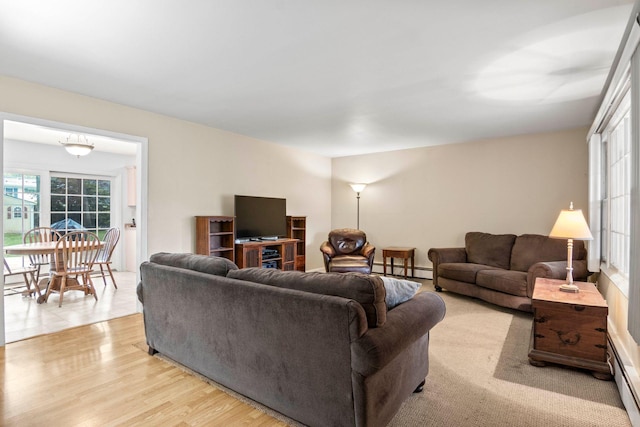 5 Seward Ln, Stony Brook, NY 11790 - living area featuring baseboard heating and light wood finished floors