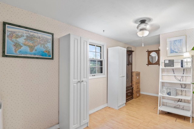 5 Seward Ln, Stony Brook, NY 11790 - corridor featuring wallpapered walls and light wood finished floors