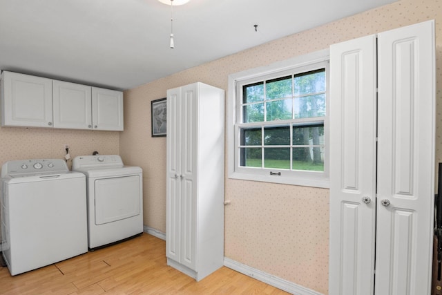 5 Seward Ln, Stony Brook, NY 11790 - laundry room with wallpapered walls, light wood finished floors, independent washer and dryer, and cabinet space