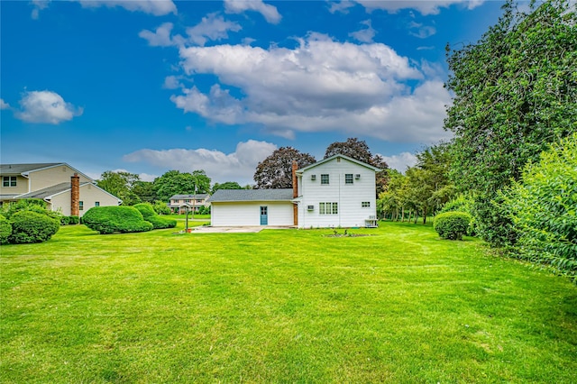 26 Village Ln, Hauppauge, NY 11788 - view of grassy yard with a patio area