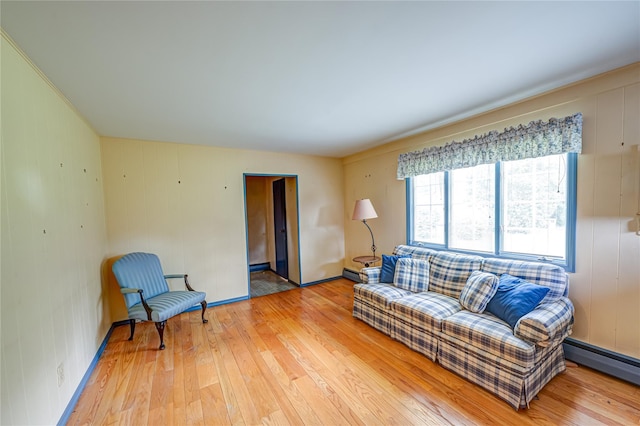 26 Village Ln, Hauppauge, NY 11788 - living room with light wood-type flooring and baseboard heating