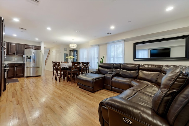 32 Janet Ln, Breezy Point, NY 11697 - living area with light wood-style floors and recessed lighting