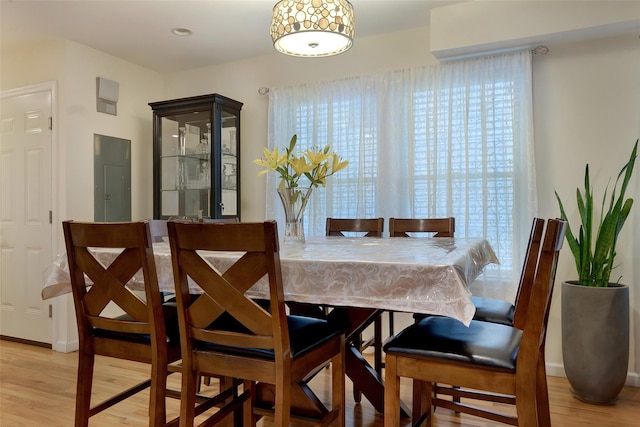 32 Janet Ln, Breezy Point, NY 11697 - dining room with light wood-type flooring and healthy amount of natural light
