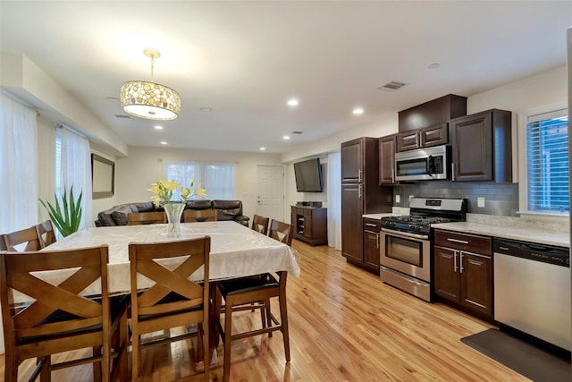 32 Janet Ln, Breezy Point, NY 11697 - dining area with plenty of natural light, light wood finished floors, and recessed lighting