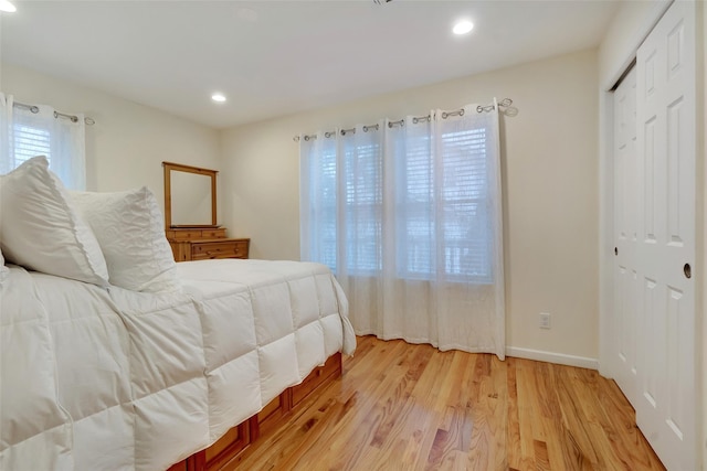 32 Janet Ln, Breezy Point, NY 11697 - bedroom featuring light wood finished floors, recessed lighting, and a closet