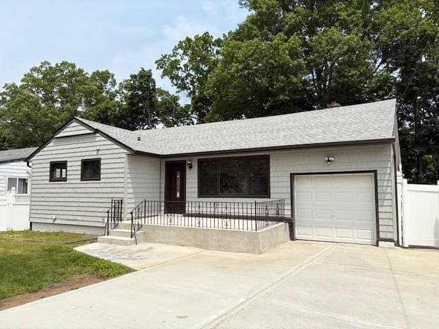 747 Janos Ln, West Hempstead, NY 11552 - ranch-style home featuring an attached garage, concrete driveway, and a shingled roof