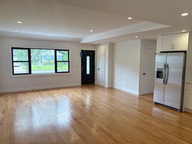 747 Janos Ln, West Hempstead, NY 11552 - unfurnished living room featuring recessed lighting and light wood-type flooring