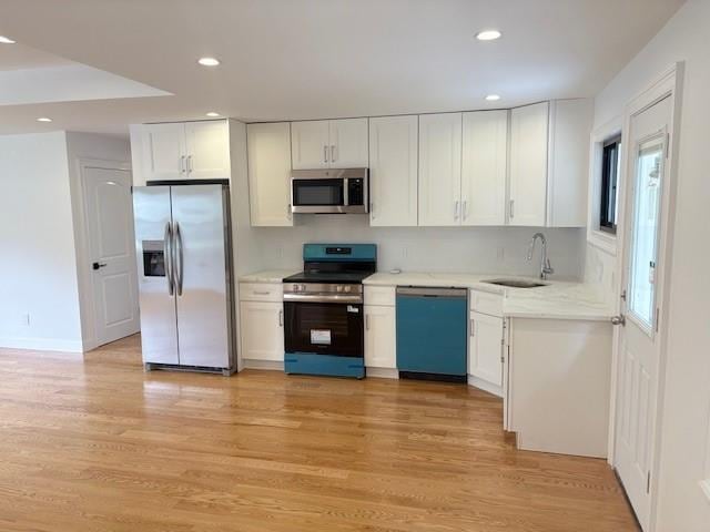 747 Janos Ln, West Hempstead, NY 11552 - kitchen featuring stainless steel appliances, white cabinetry, light wood-style flooring, and recessed lighting