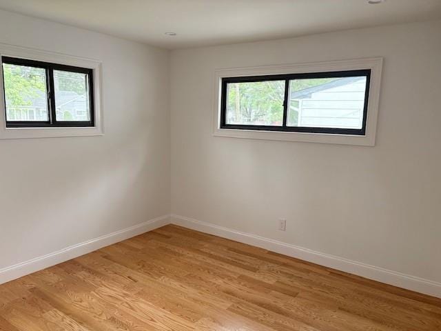 747 Janos Ln, West Hempstead, NY 11552 - unfurnished room featuring baseboards and light wood-style floors