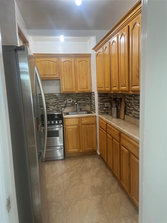 66-92 Selfridge St Unit 3J, Forest Hills, NY 11375 - kitchen with appliances with stainless steel finishes, tasteful backsplash, light countertops, and brown cabinets