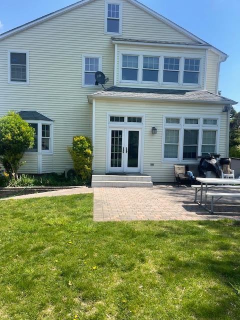 60 Hartsdale Rd, Elmsford, NY 10523 - back of house featuring a yard, a patio area, and french doors