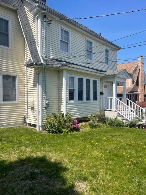 60 Hartsdale Rd, Elmsford, NY 10523 - rear view of house with a yard