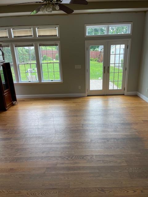 60 Hartsdale Rd, Elmsford, NY 10523 - empty room featuring a ceiling fan, wood finished floors, and french doors