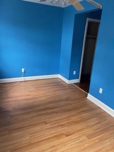 60 Hartsdale Rd, Elmsford, NY 10523 - unfurnished bedroom with wood finished floors and a closet