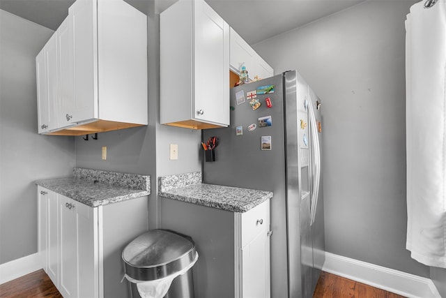 2031 Rte 302, Circleville, NY 10919 - kitchen with stainless steel fridge, white cabinets, dark wood-style flooring, and light stone counters