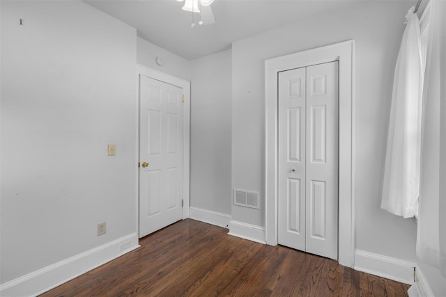 2031 Rte 302, Circleville, NY 10919 - unfurnished bedroom with dark wood-style floors, a closet, and a ceiling fan