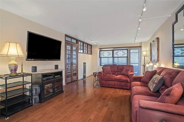 70-20 108th St Unit 5P, Forest Hills, NY 11375 - living room with track lighting, wood finished floors, and plenty of natural light