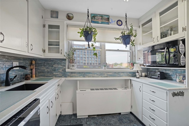 70-20 108th St Unit 5P, Forest Hills, NY 11375 - kitchen with dishwasher, black microwave, light countertops, and decorative backsplash