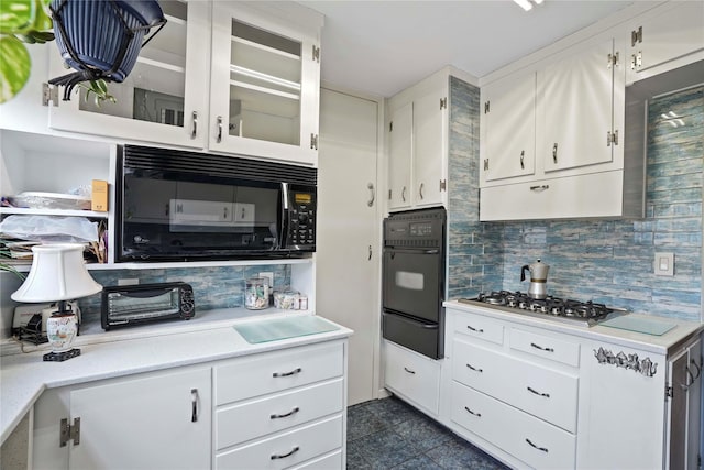 70-20 108th St Unit 5P, Forest Hills, NY 11375 - kitchen featuring black appliances, a warming drawer, backsplash, and light countertops